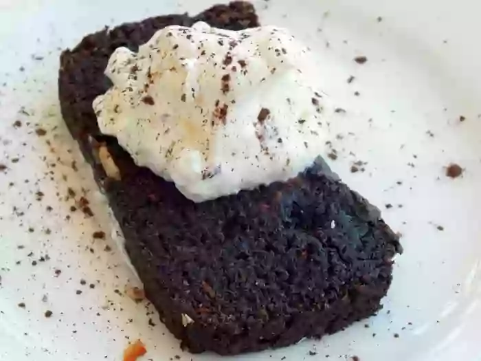 Low-carb chocolate pound cake with whipped cream.
