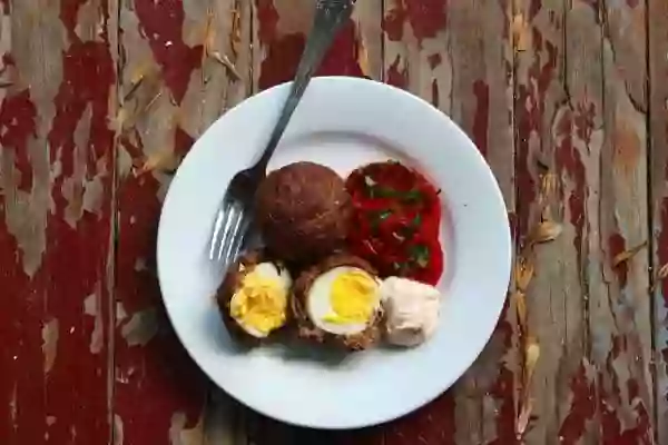 Baked Scotch Eggs are Tex Mex style in a spicy, smoky ground beef mixture. Lowcarb-ology.com