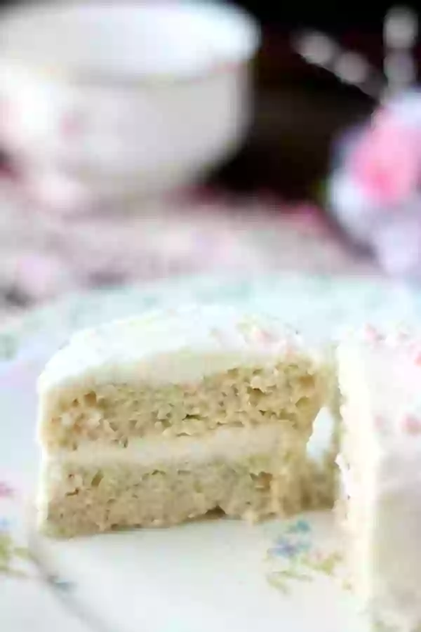 This easy low carb cake recipe is light and fluffy with a creamy white chocolate almond frosting - from Lowcarb-ology.com