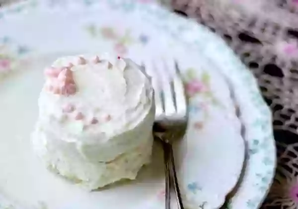 Easy low carb cake recipe has a fluffy texture and creamy white chocolate frosting. From Lowcarb-ology.com