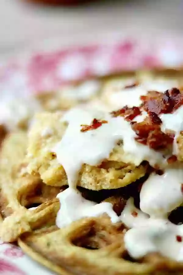 Low carb chicken and waffles recipe is a Southern-comfort-food- can't-stop-eating-it dance of spicy, creamy, sweet, salty, crispy, tender goodness. Just 10 net carbs per serving. From Lowcarb-ology.com