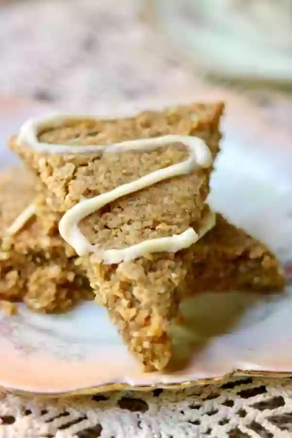 Welcome fall with these low carb Autumn Spice Scones topped with a toffee cream cheese glaze. From RestlessChipotle.com