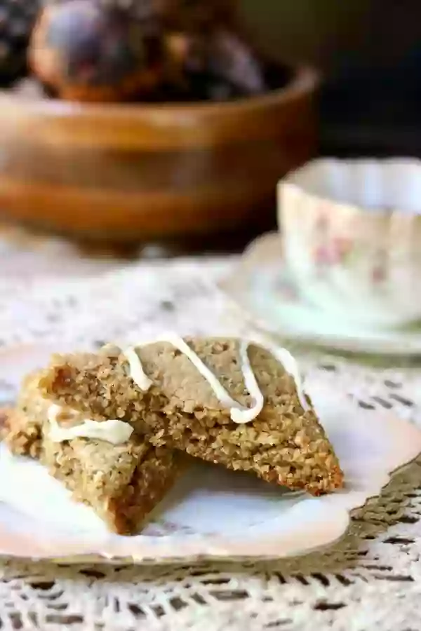 Welcome fall with these low carb Autumn Spice Scones topped with a cream cheese glaze. From RestlessChipotle.com