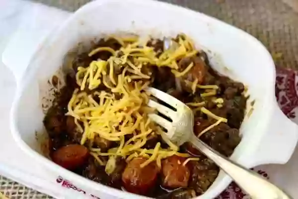 feature image of the low carb chili dog bake in a vintage corningware dish