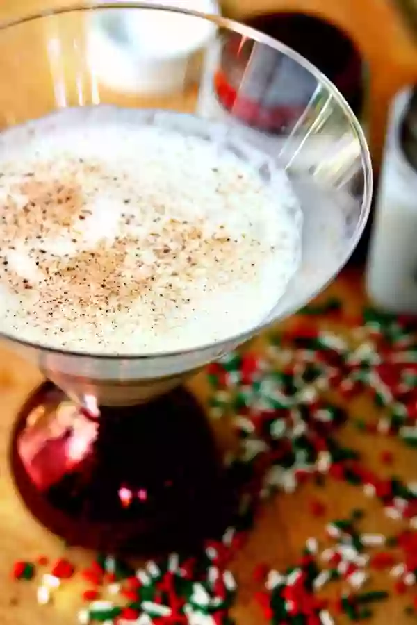 Close up of the top of the creamy low carb Christmas cookie martini which has been sprinkled with nutmeg.