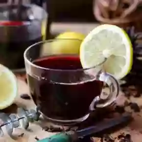 Recipe image, low carb hot mulled wine with a lemon slice on the edge.