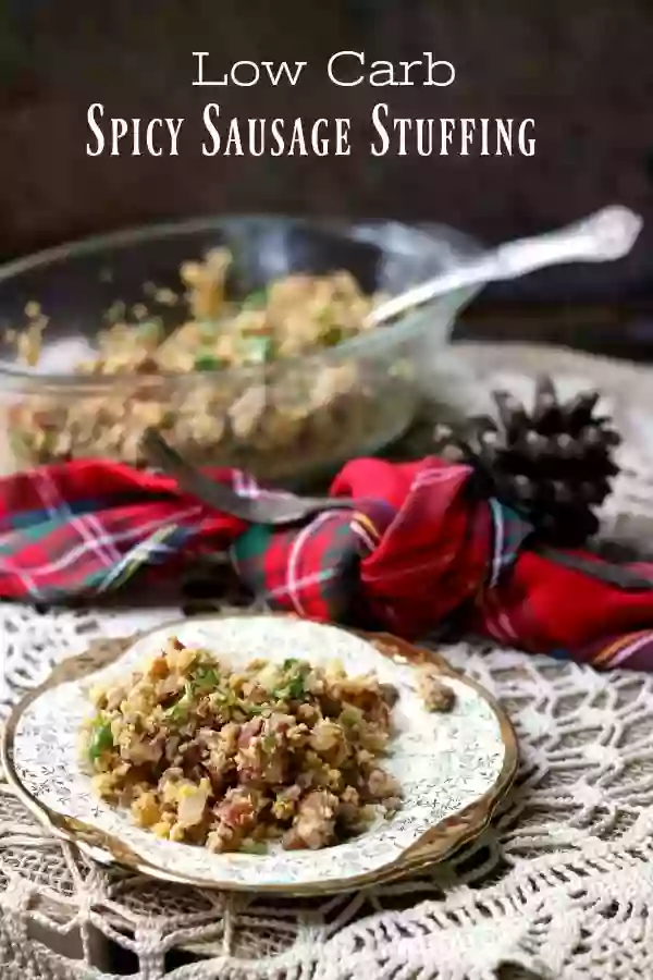 Title image. A spoonful of low carb sausage dressing is on a gold rimmed plate with a red plaid napkin in the background. 