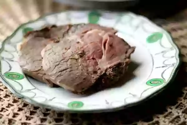 Slices of boneless prime rib roast on an art deco plate