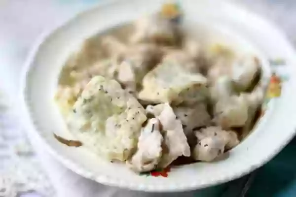 Southern chicken and dumplings in a bowl - feature image for this post