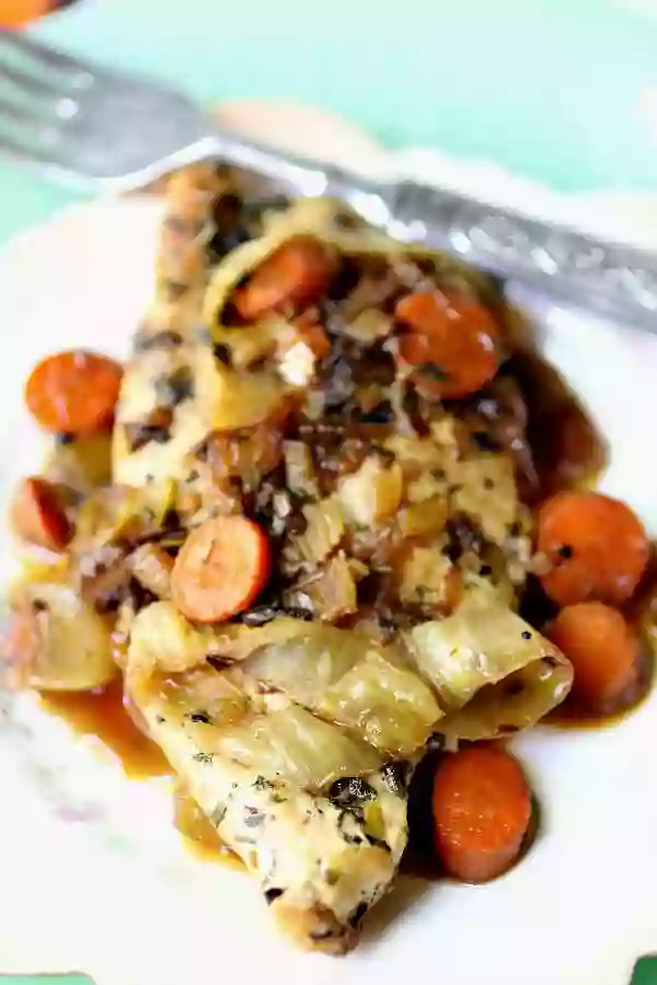 Close up of low carb French chicken recipe with carrots and onions mounded on top