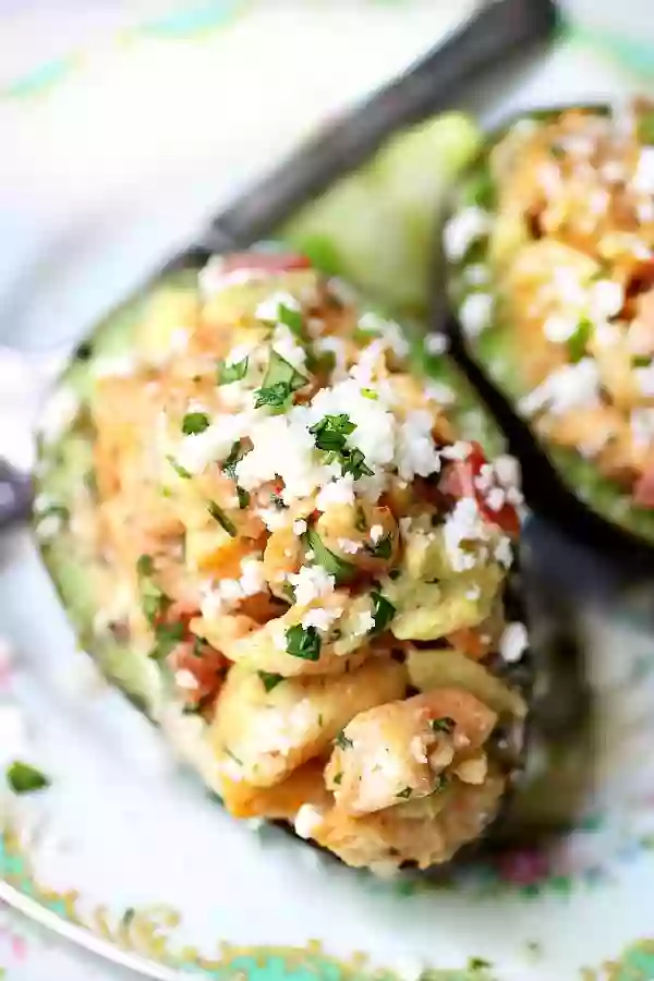 Closeup Image of the Southwestern Chicken Salad Stuffed Avocados on a Plate.