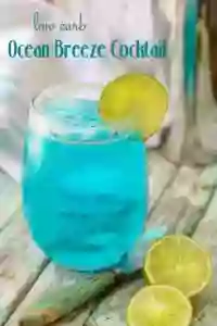 Bright Blue Low Carb Cocktail Garnished With a Lime. 