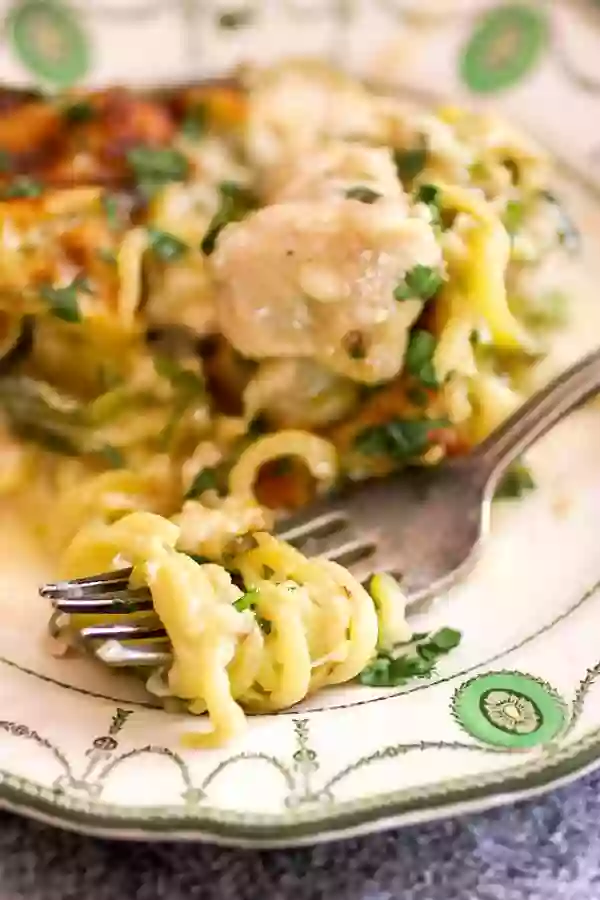 Low carb chicken tetrazzini zoodles wrapped around a fork -ready to eat