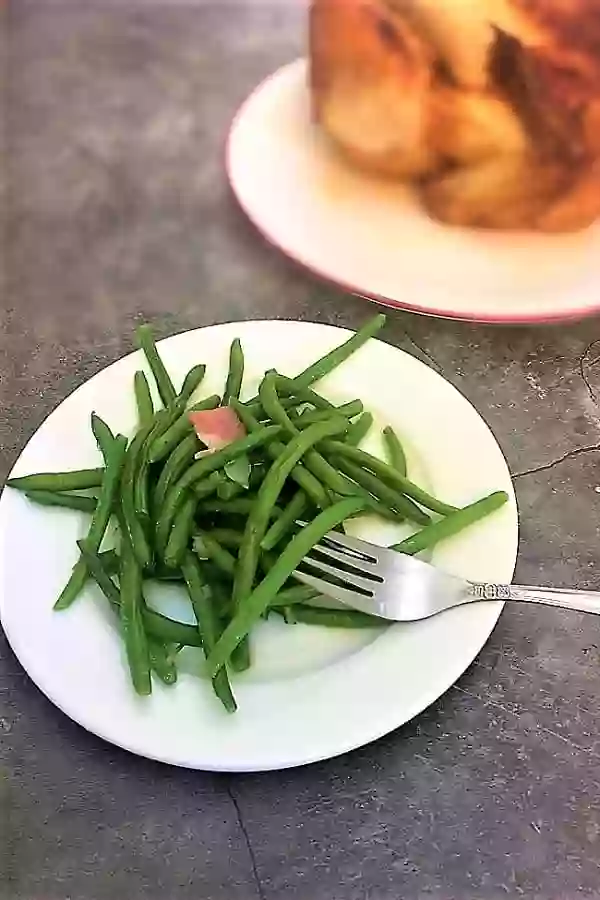 Bright Green Southern Green Beans With Bits of Bacon, Onion and Seasonings.