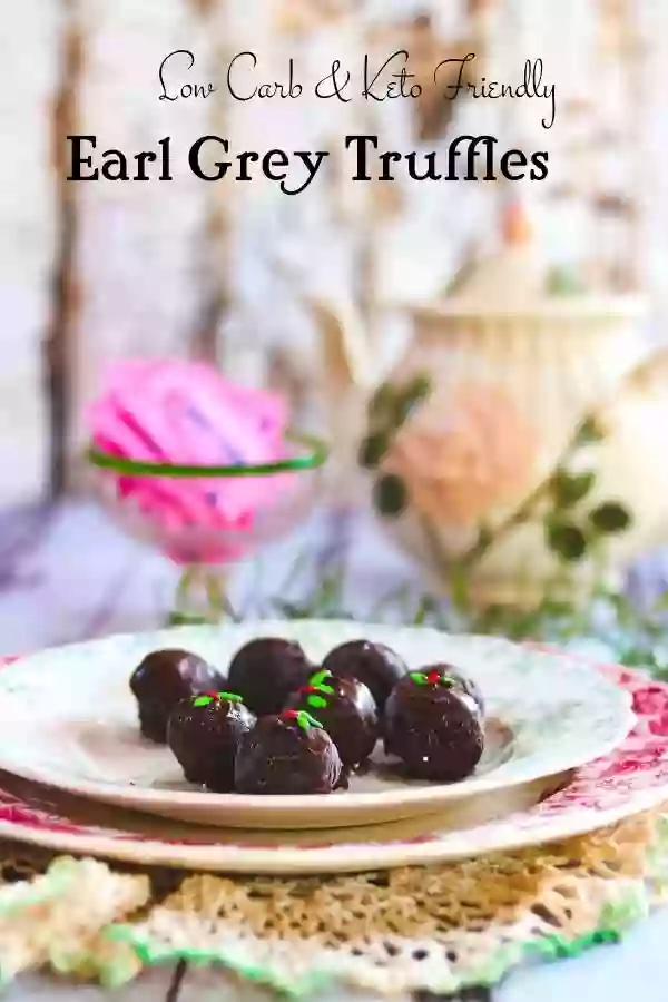 Chocolate truffles on a plate with a tea kettle in the background
