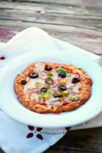 Just 2 net carbs! Low carb pizza crust recipe is quick and easy and has the perfect texture! From Lowcarb-ology.com