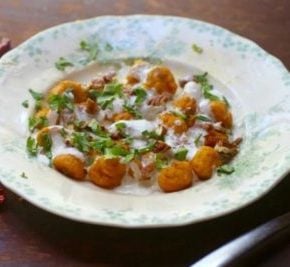 low carb pumpkin gnocchi recipe is topped with a spicy crema sauce, pecans, and cilantro. From RestlessChipotle.com