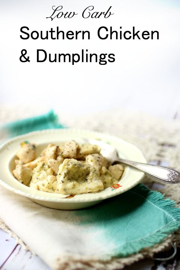 Southern low carb chicken and dumplings that I made in a shallow bowl and a light blue napkin.
