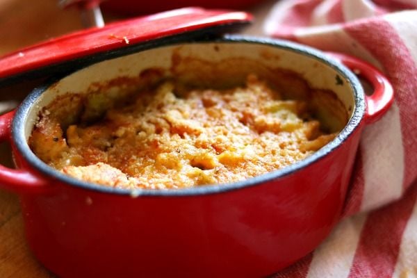 Crumb topping on creamy low carb scalloped turkey in a red dish